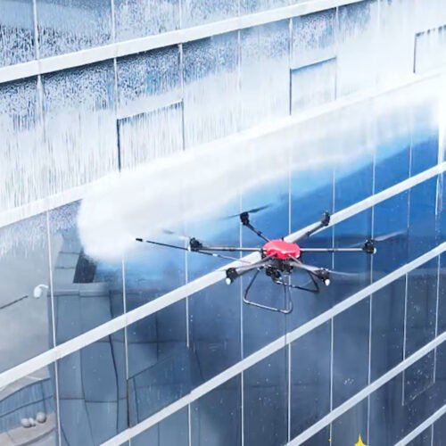 cleaning drone spraying water on glass building facade high rise drone cleaning system