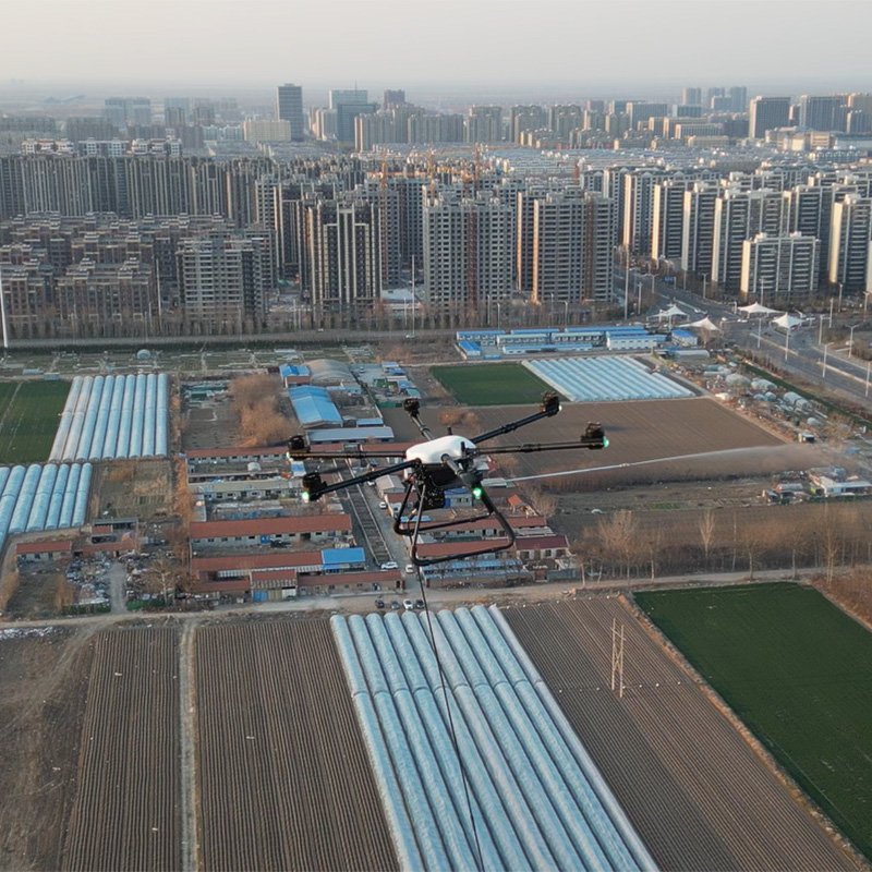 High-altitude cleaning drone in operation over urban and agricultural areas
